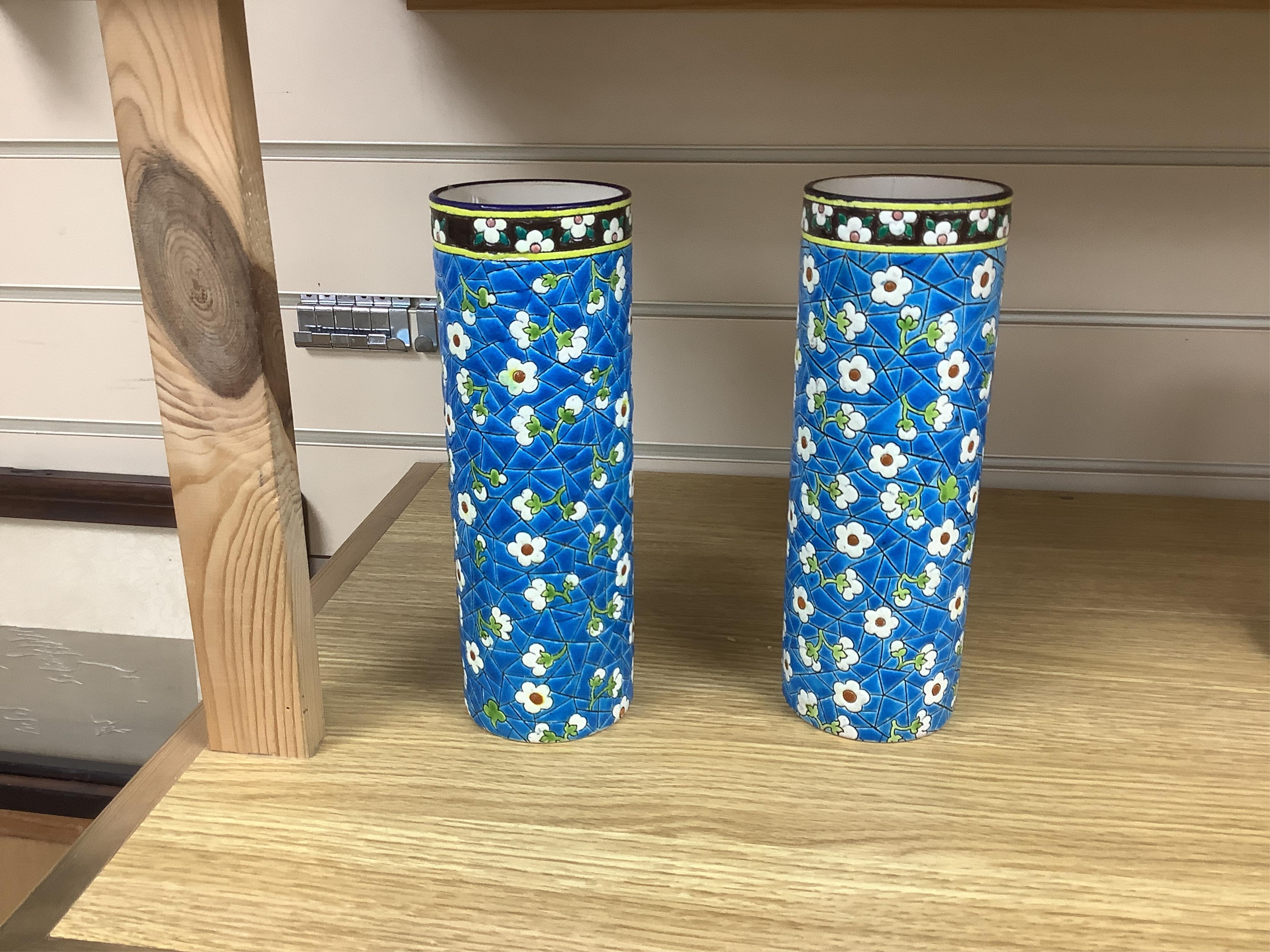 A pair of Longwy pottery cylindrical vases, 23cm high. Condition - one good, minor chip to base, other is cracked